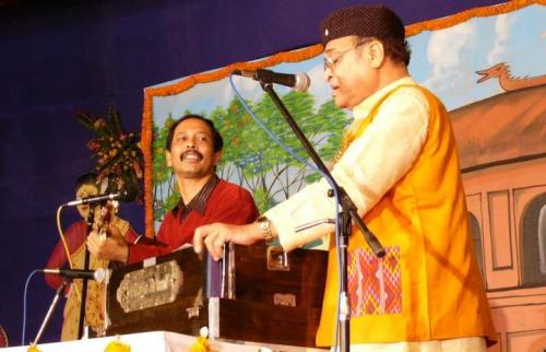 Dr. Bhupen Hazarika sings during Rongpur Festival, 2005.