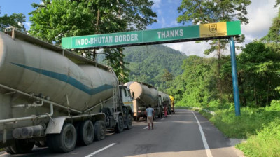 How Many Kilometers Of International Border Does Assam Share With Bhutan?